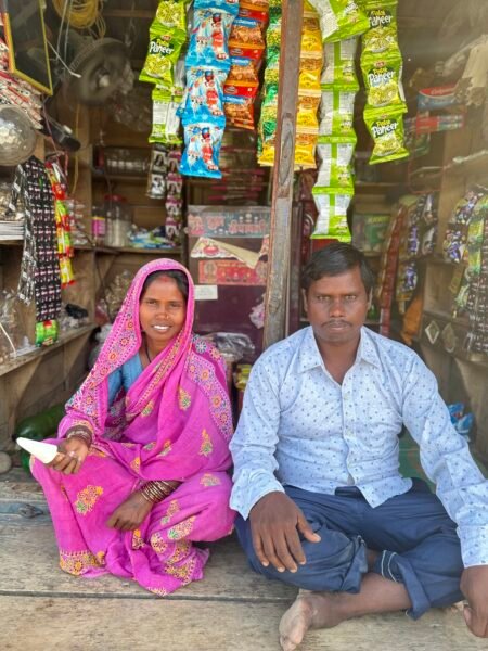 Sita and his husband Maheshor pose while inside their small roadside grocery shop in their village in Nepal
